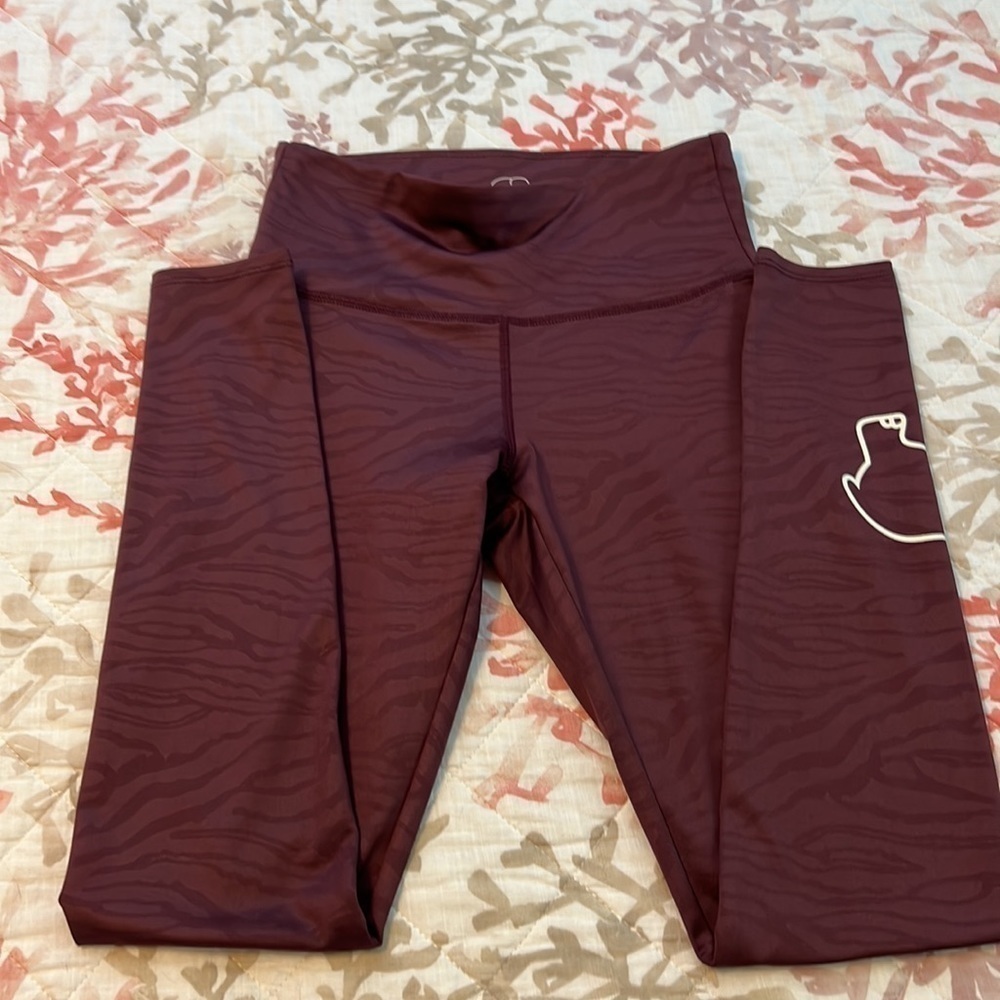 Ivory Ella Maroon colored Leggings, fabric has animal markings throughout